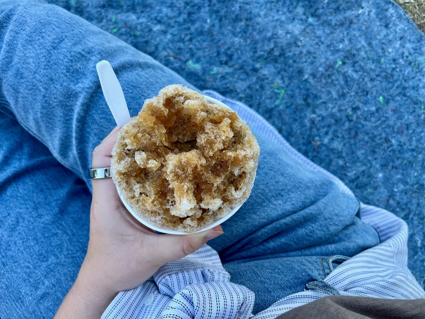 I'm holding a cup of root beer shaved ice 