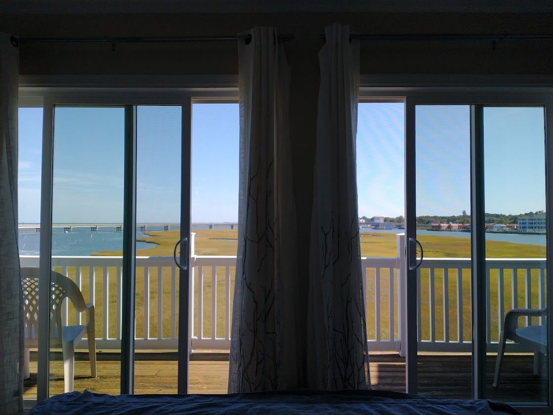 beautiful views of marshes, water, and the town of Chincoteague from the bedroom of our condo