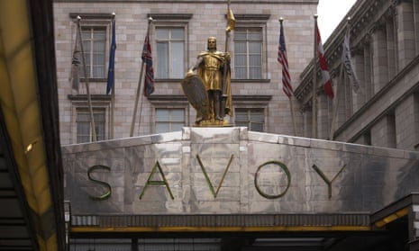 The Strand entrance to the Savoy hotel with a gilt statue of a knight