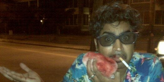 Image may contain Face Human Person Clothing Apparel Glasses Accessories Accessory Smoke and Smoking