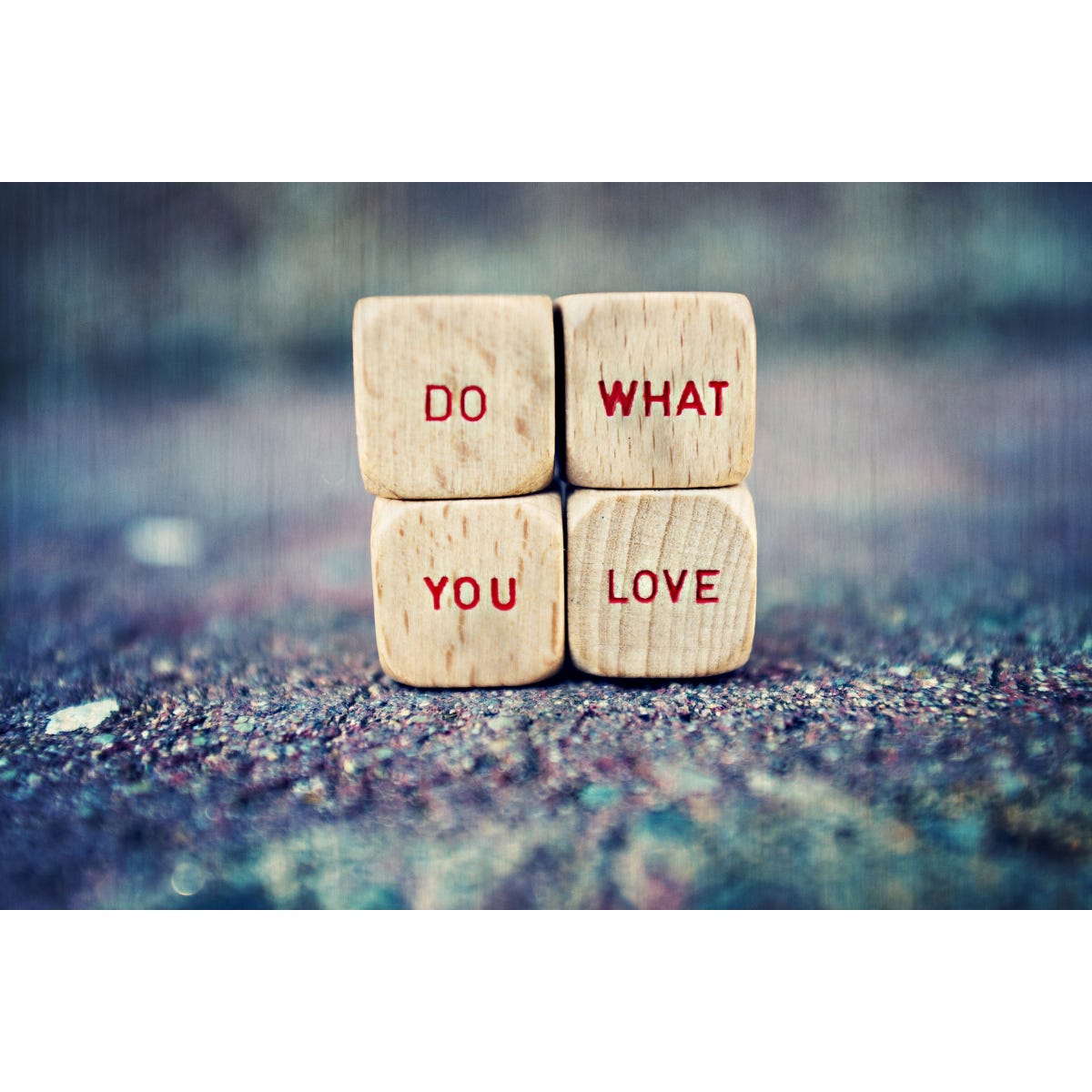 4 wooden dice with the words do what you love