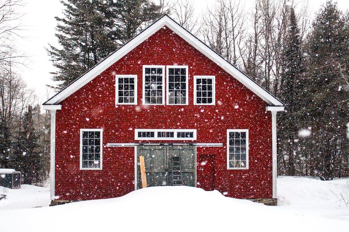 Free A Red House on Snow Covered Ground Stock Photo