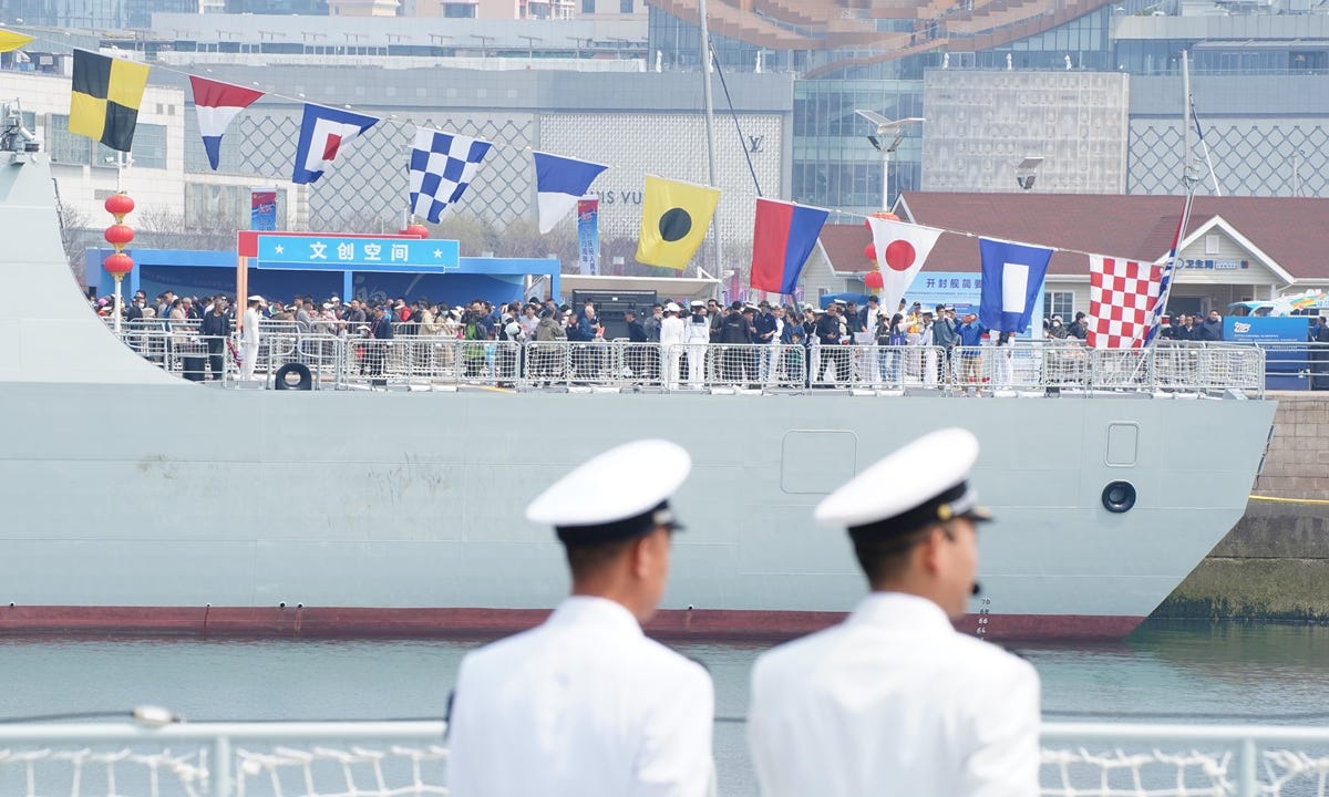 People tour the missile destroyers <em>Kaifeng</em> in Qingdao Port of Qingdao, East China's Shandong Province, on April 22, 2024. The Chinese People's Liberation Army Navy holds open day events in multiple coastal cities including Qingdao around April 23 to mark the 75th anniversary of its founding. Photo: VCG