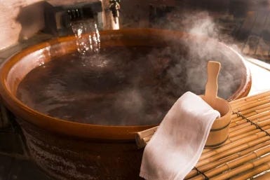 steaming hot wooden tub perfect for a soothing sleep