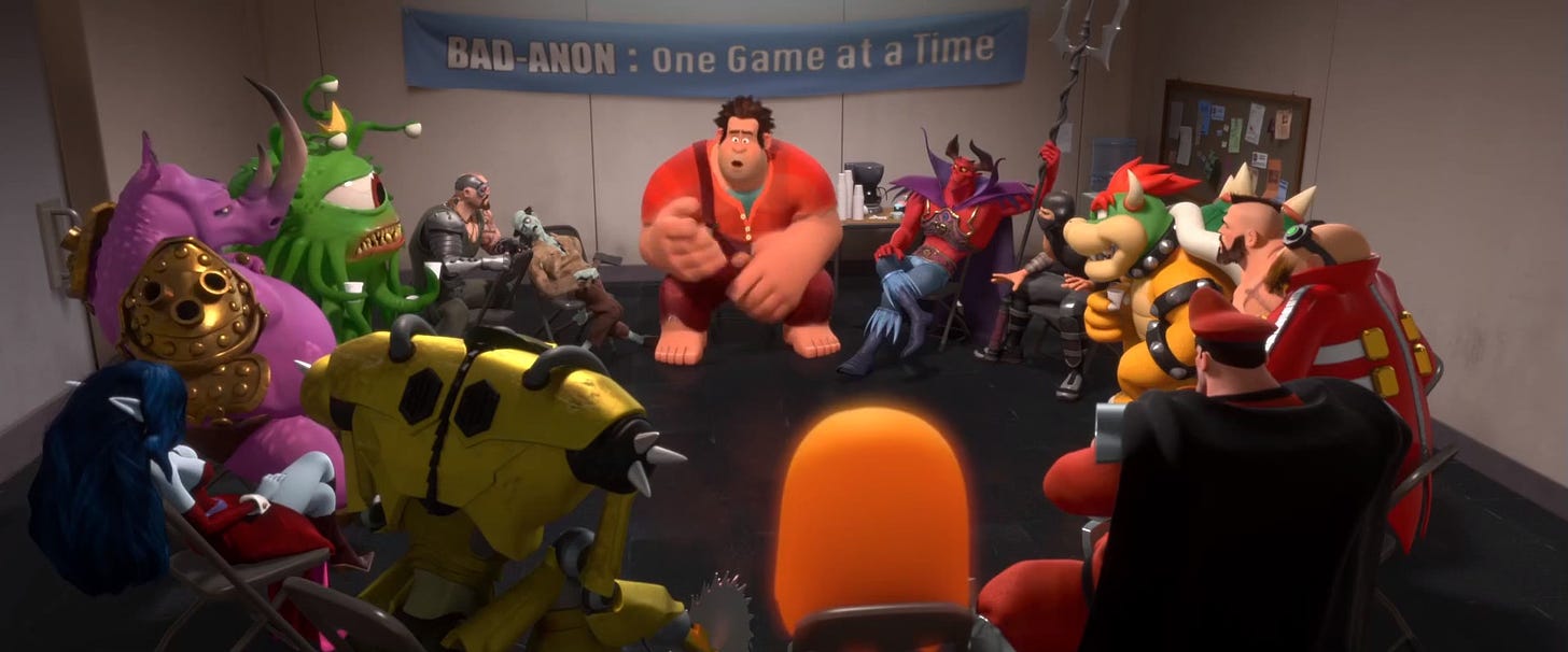 Screen shot from Wreck-It Ralph with Ralph in the center of the frame, seated for a BAD-ANON meeting. Banner behind him says: Bad-Anon: One Game at a Time. Surrounded by other video game villains including a zombie, Bowser, Zangief, and Kano.