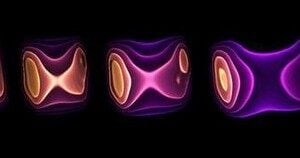 This graphic shows the energy density (yellow is high; purple is low) at different times during the hydrodynamic evolution of matter created in a collision of a lead ion (moving to the left) with a photon emitted from another lead ion (moving to the right
