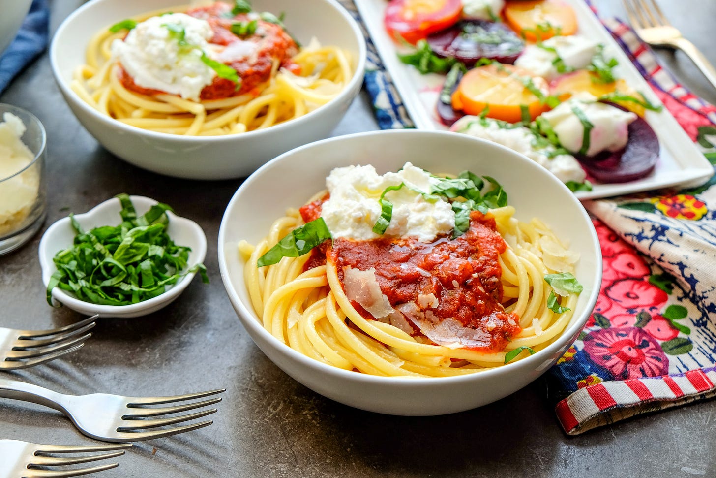 Bowl of pasta with marinara sauce and ricotta with fresh herbs