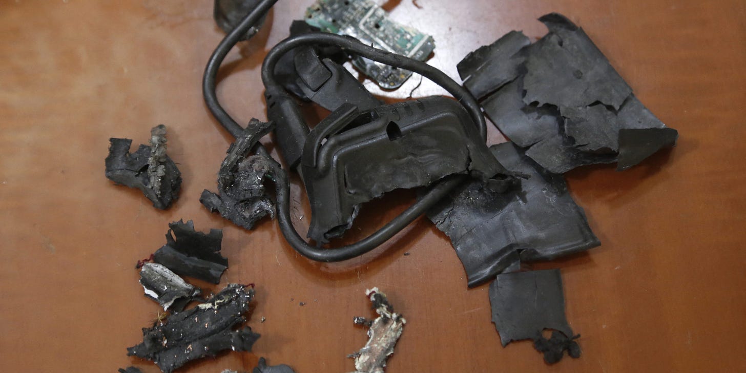 A photo taken on September 18, 2024, in Beirut's southern suburbs shows the remains of exploded pagers on display at an undisclosed location. Hundreds of pagers used by Hezbollah members exploded across Lebanon on September 17, killing at least nine people and wounding around 2,800 in blasts the Iran-backed militant group blamed on Israel. (Photo by AFP) (Photo by -/AFP via Getty Images)