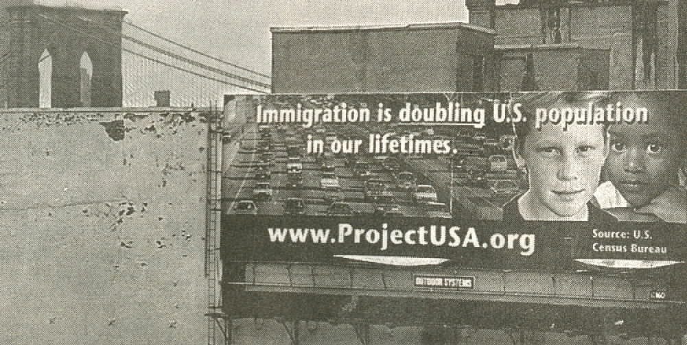 Billboard at the foot of the Brooklyn Bridge reading "Immigration is doubling US population in our lifetimes" and features a white boy and black girl looking at the viewer.