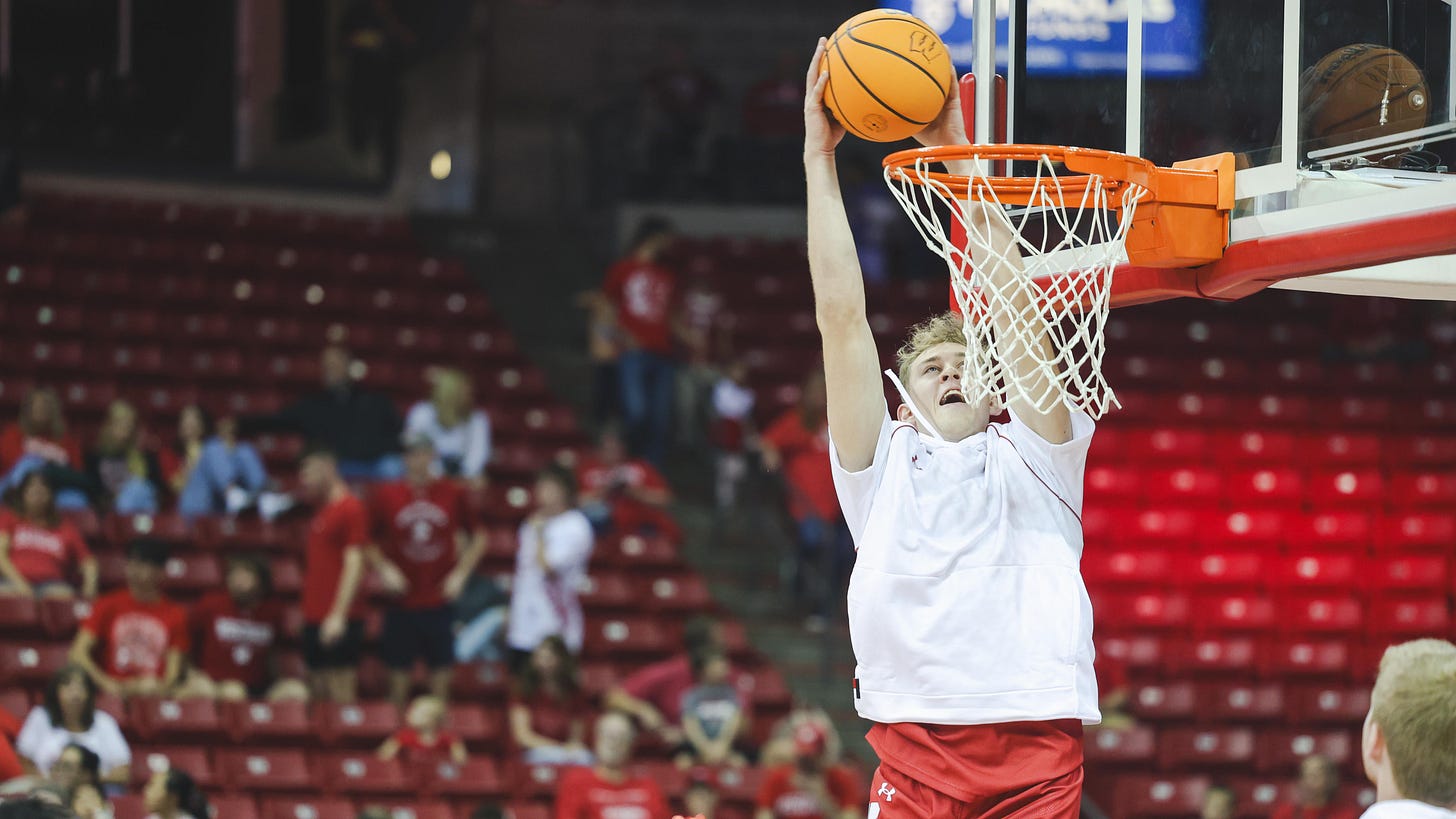 Wisconsin Badgers forward Markus Ilver throws down a dunk