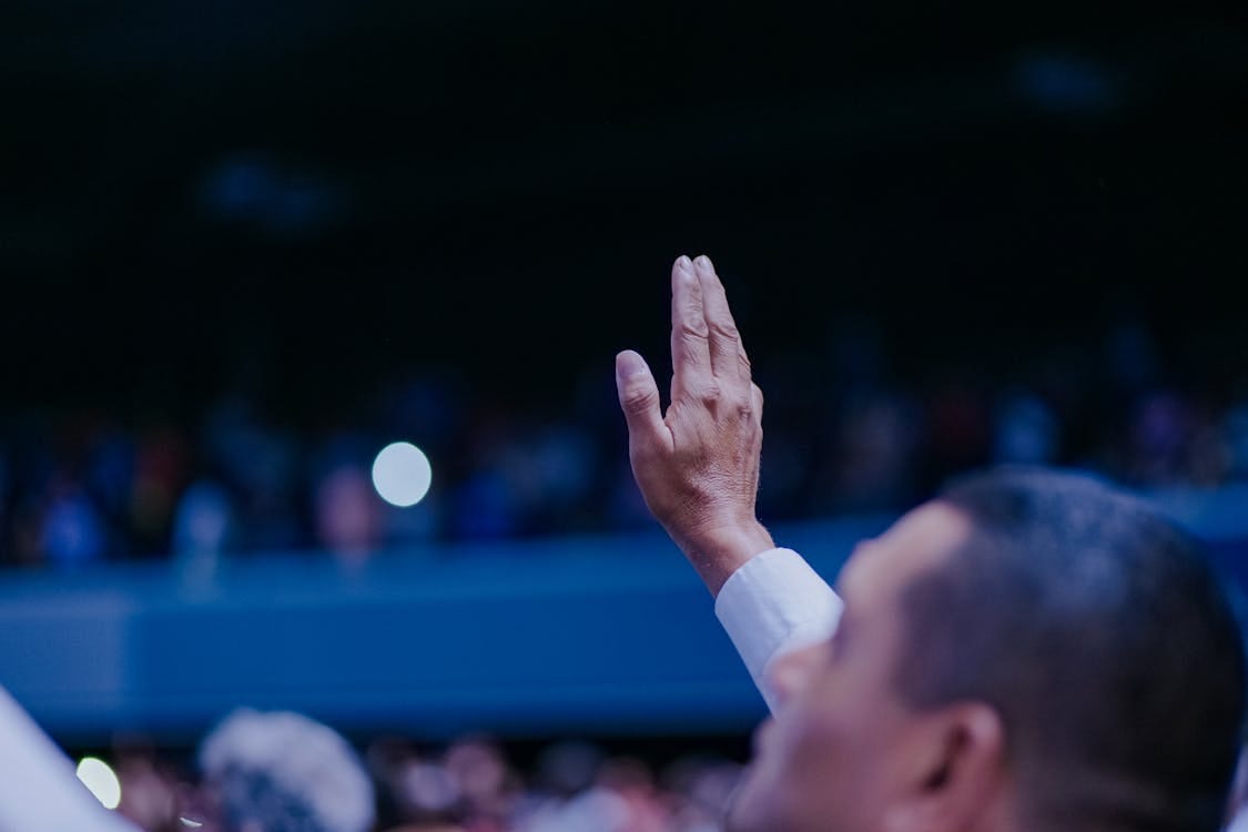 Free Raised Hand of Man Stock Photo