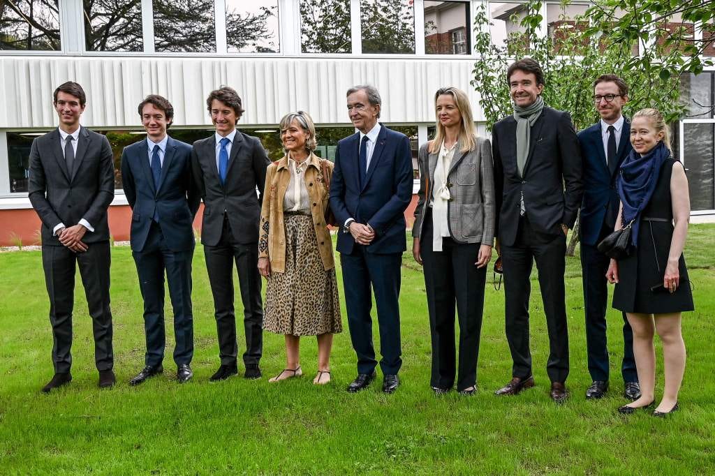 Bernard Arnault (C) poses with his wife Helene, and his children Antoine, Delphine, Alexandre and Frederic during the inauguration of the Jean Arnault campus.