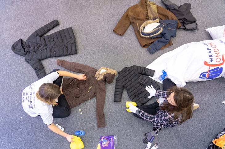 Aerial view of people sorting coats