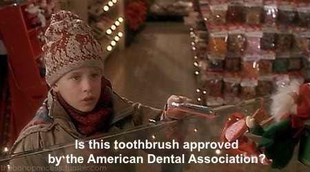 In Home Alone (1990), in the scene where Kevin asks if the American Dental  Association (ADA) has approved a toothbrush, the ADA's seal of approval can  be seen when the cashier turns