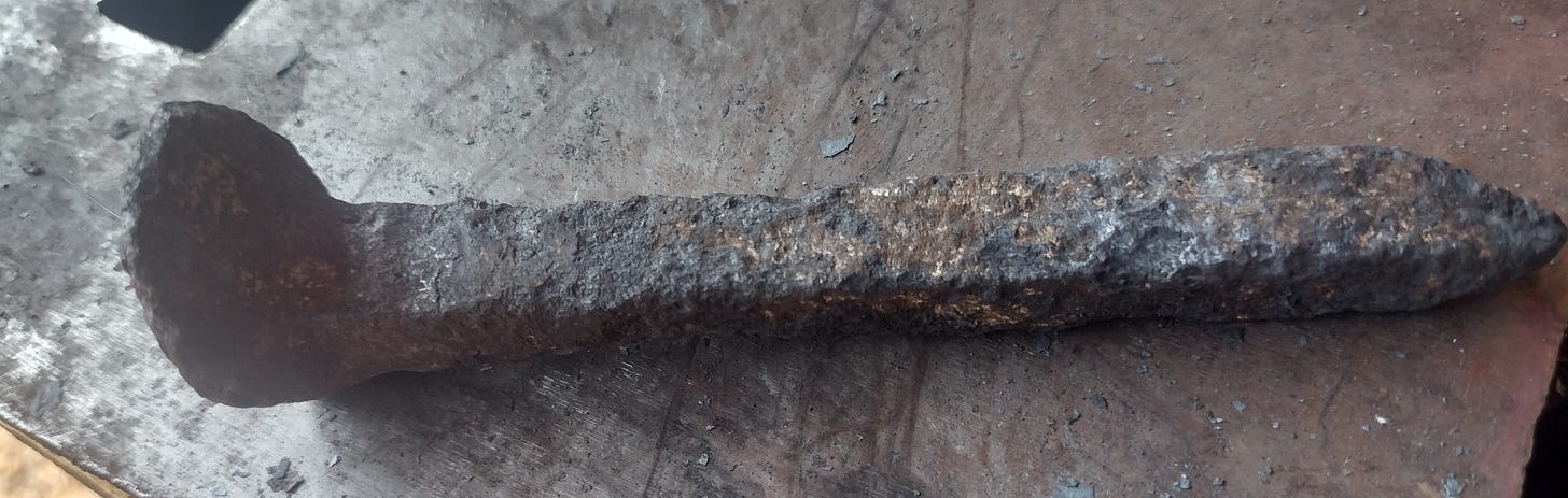 a very pitted railroad spike