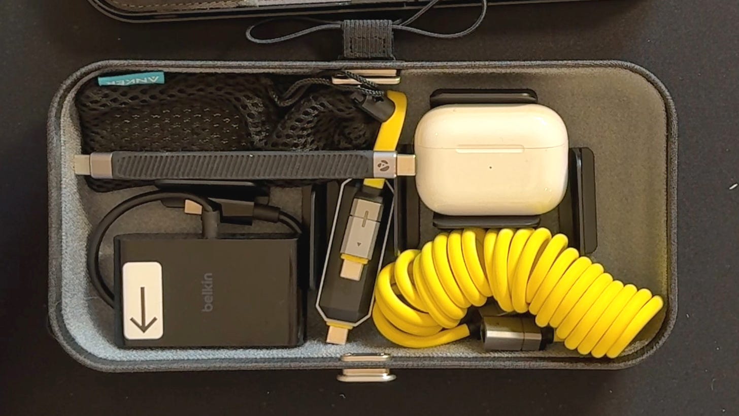 The inside of the bottom of the Nest v2 case. it is full of cables and other small paraphernalia 