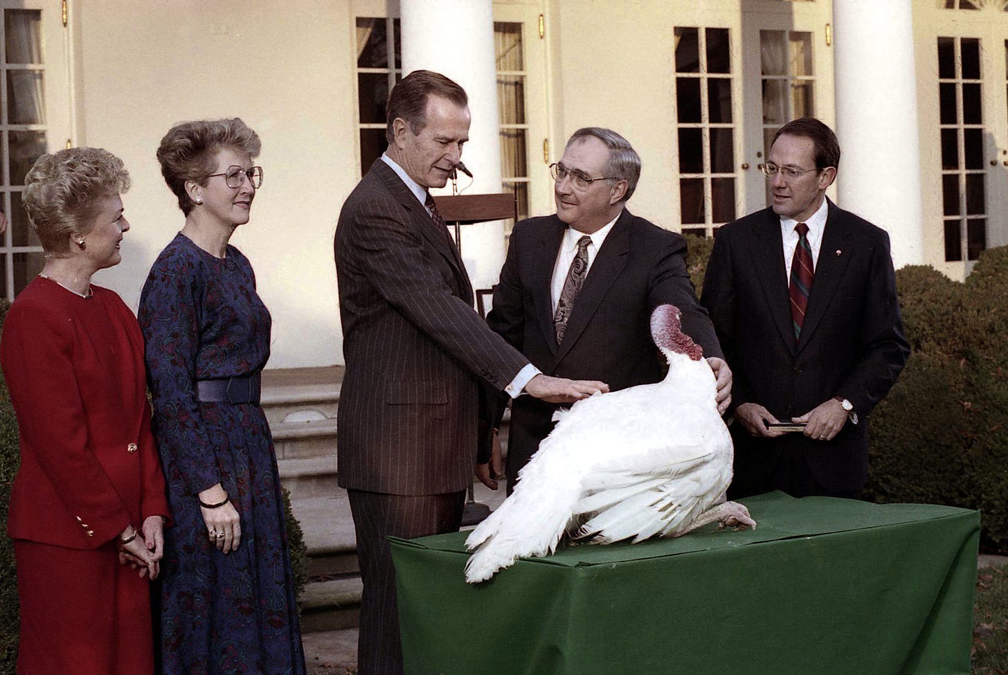 President George H.W. Bush is pictured pardoning a turkey.