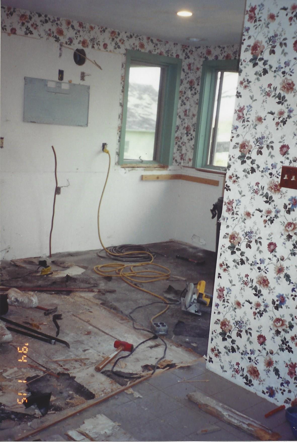 A messy construction scene in a kitchen being remodeled