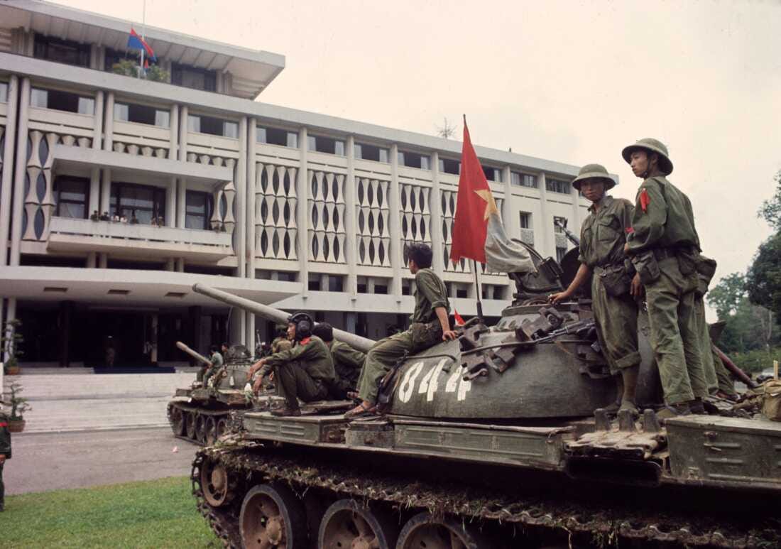 Victorious North Vietnamese troops on tanks take up positions outside Independence Palace in Saigon, April 30, 1975, the day the South Vietnamese government surrendered, ending the Vietnam War. Communist flags fly from the palace and the tank. (AP Photo/Yves Billy) Victorious North Vietnamese troops on tanks take up positions outside Independence Palace in Saigon, April 30, 1975, the day the South Vietnamese government surrendered, ending the Vietnam War. Communist flags fly from the palace and the tank. (AP Photo/Yves Billy)