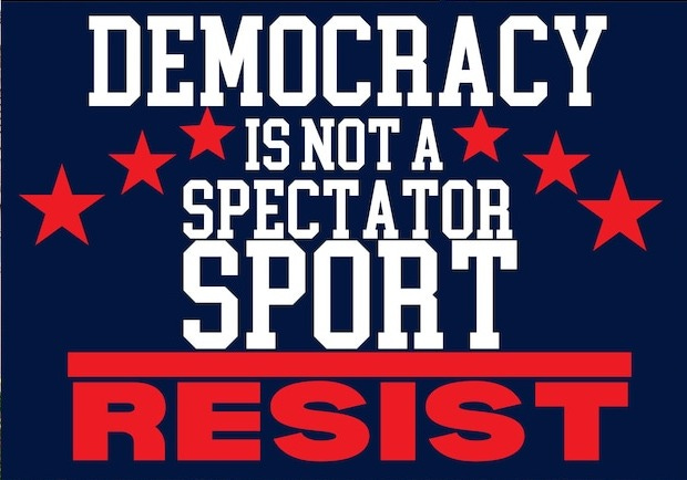 May include: A blue and red yard sign with white text that reads 'Democracy is not a spectator sport resist'. The sign has four red stars on the top and bottom.