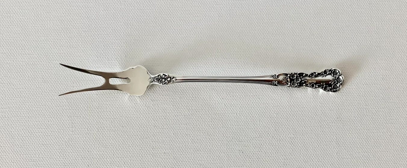 olive fork with two prongs.