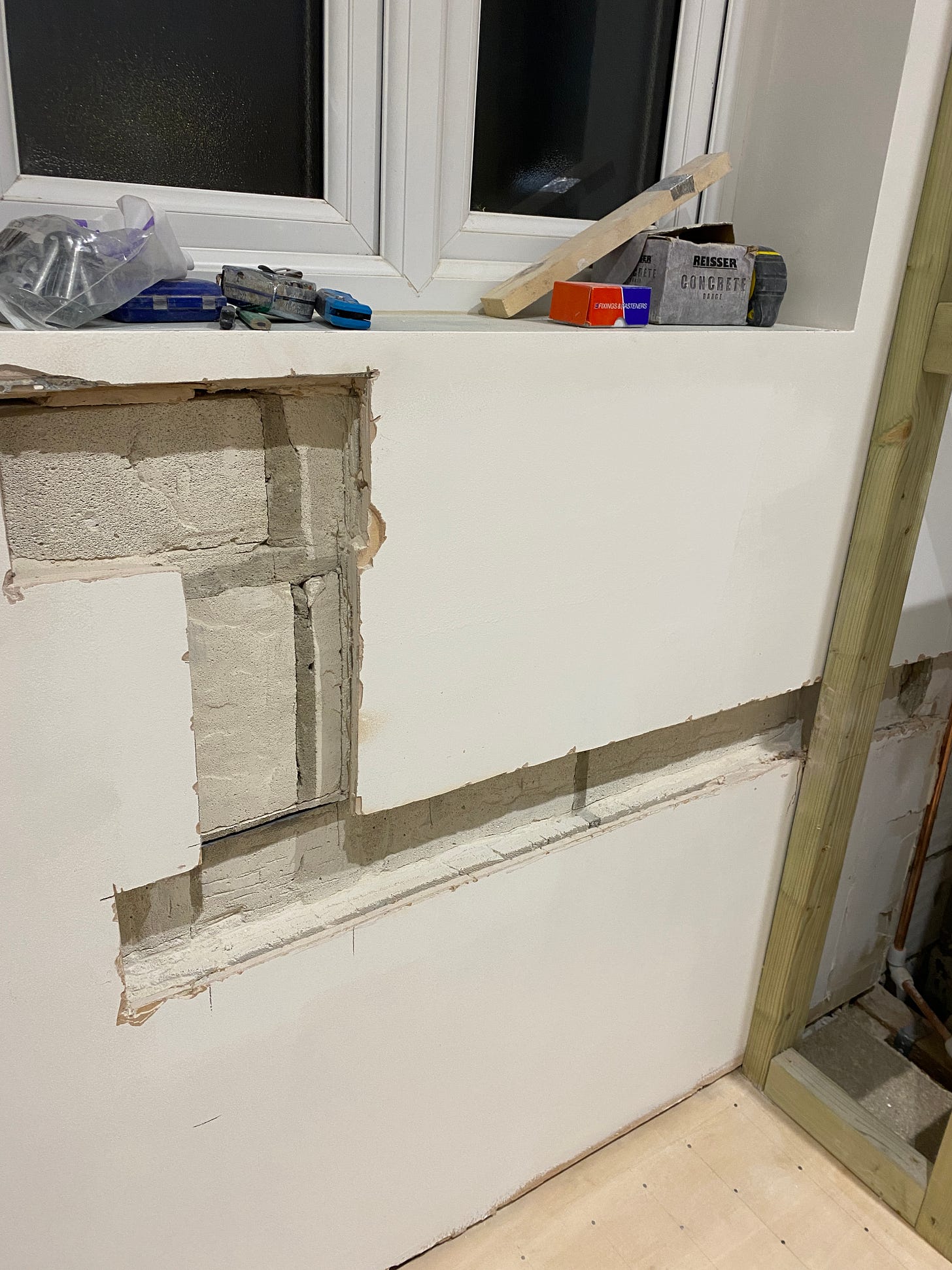 part of the wall cut out in preparation for pipework to be applied