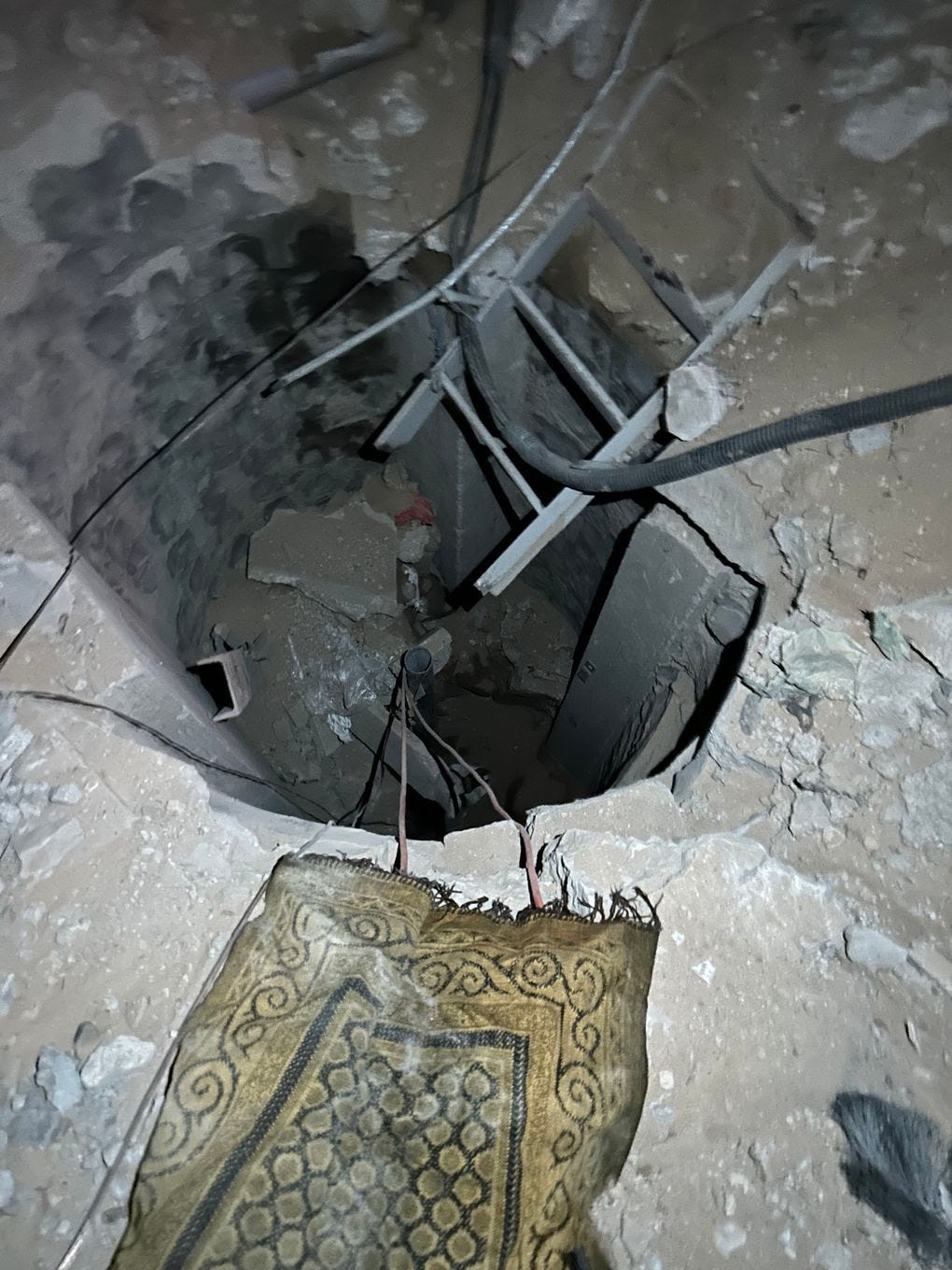 Israeli military officials say this opening recently uncovered within the compound wall of Gaza’s al-Shifa Hospital is a shaft that connects to a Hamas tunnel network. (Steve Hendrix/The Washington Post)
