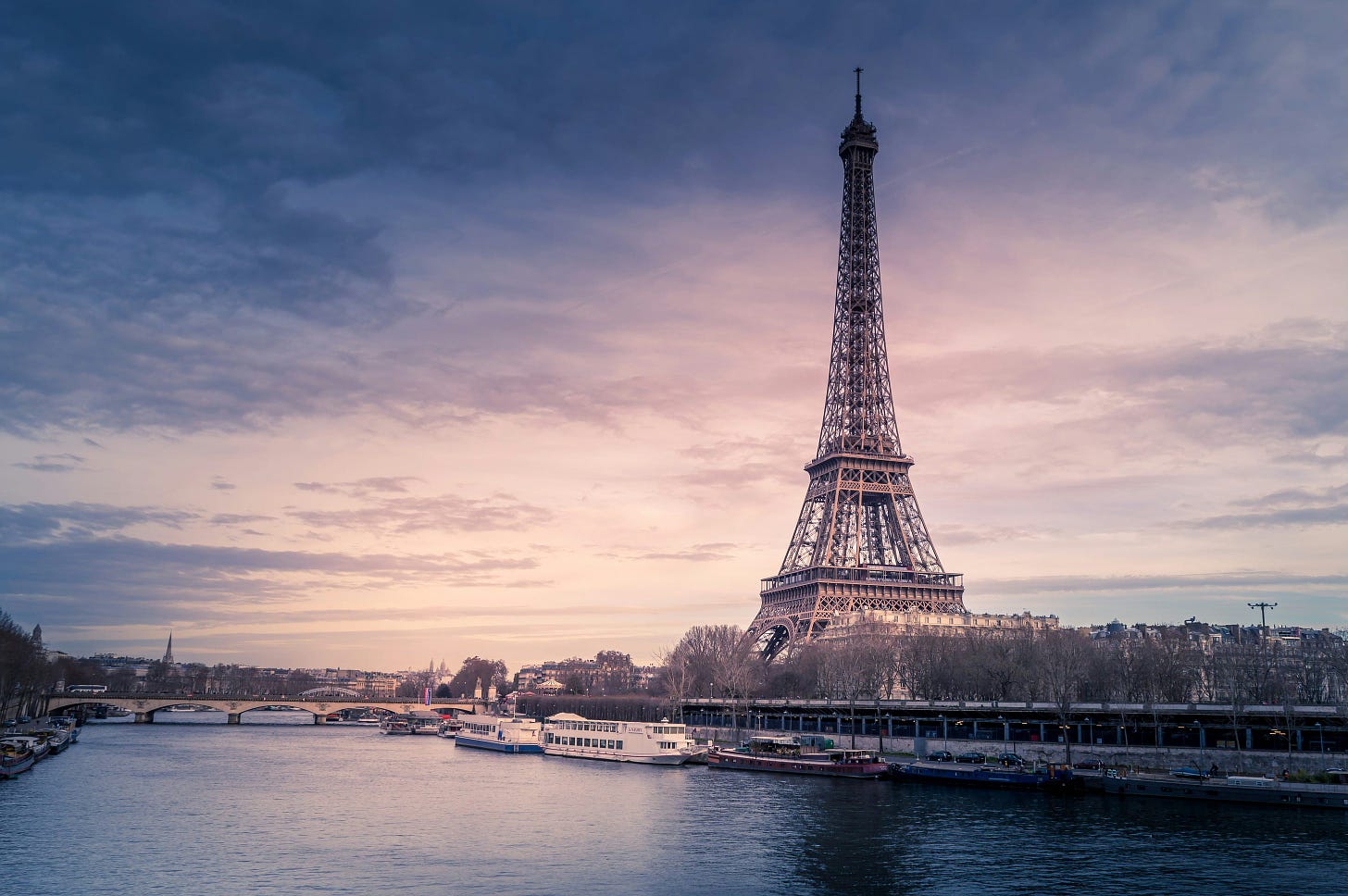 The Eiffel Tower in front of the Seine in Paris