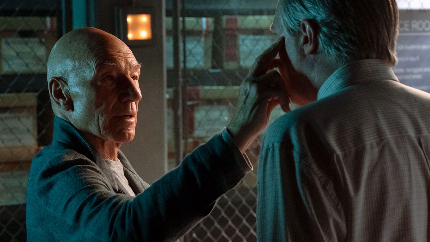 This image shows Jean-Luc Picard (played by Patrick Stewart) touching the left temple and cheek of Martin Wells (played by Jay Karnes) to re-create the classic mind-meld posture that Wells remembers from his boyhood encounter with Vulcans in the woods. This image shows Jean-Luc Picard (played by Patrick Stewart) touching the left temple and cheek of Martin Wells (played by Jay Karnes) to re-create the classic mind-meld posture that Wells remembers from his boyhood encounter with Vulcans in the woods.