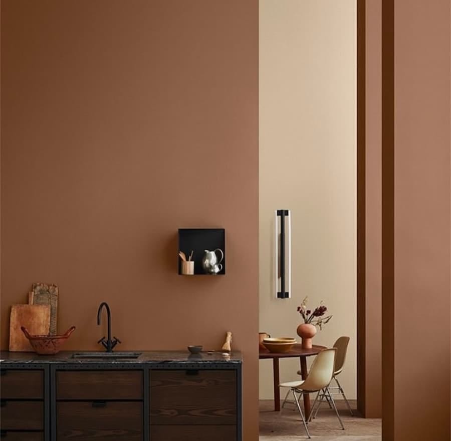 mocha mousse painted walls with wooden sink 