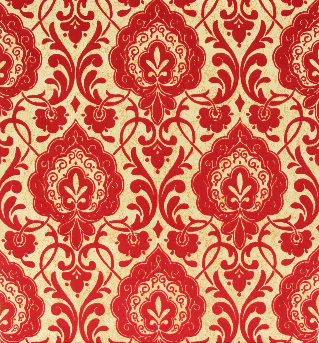 A swatch of wallpaper featuring crimson floral and leaf pattern on a gold background