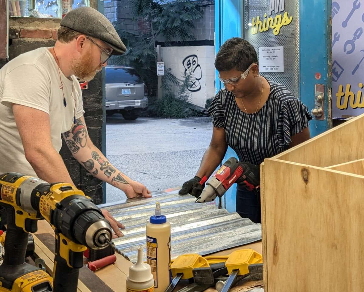 Devon Curtin helps teach a little free library workshop at PVD Things in 2024.