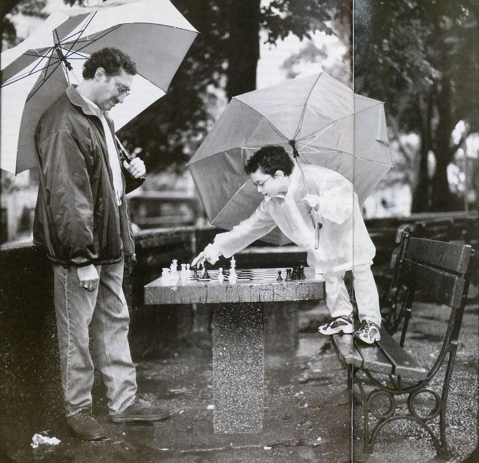r/chess - 8-year-old Fabiano Caruana with his coach Bruce Pandolfini at Washington Square Park, New York