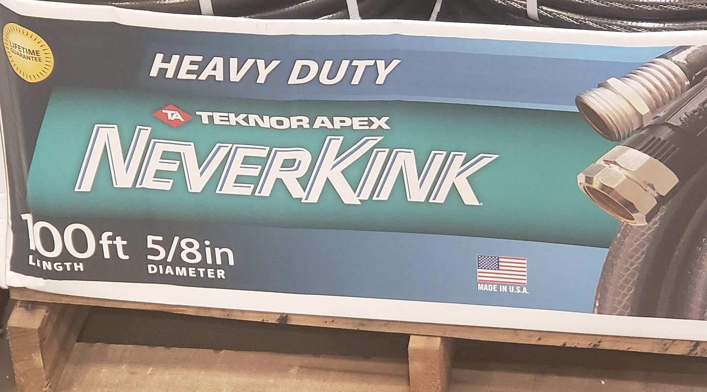 a box of hoses that says TEKNOR APEX NEVERKINK with some questionable kerning