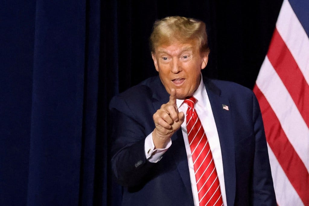 Donald Trump gestures to supporters during a campaign rally at the Forum River Center in Rome, Georgia, U.S. March 9, 2024.