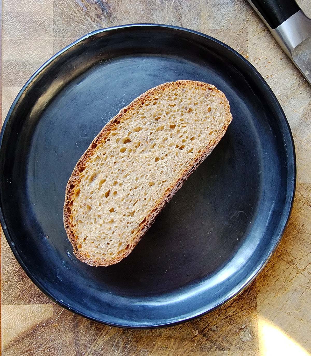 A slice of Dakota rye on a plate. 