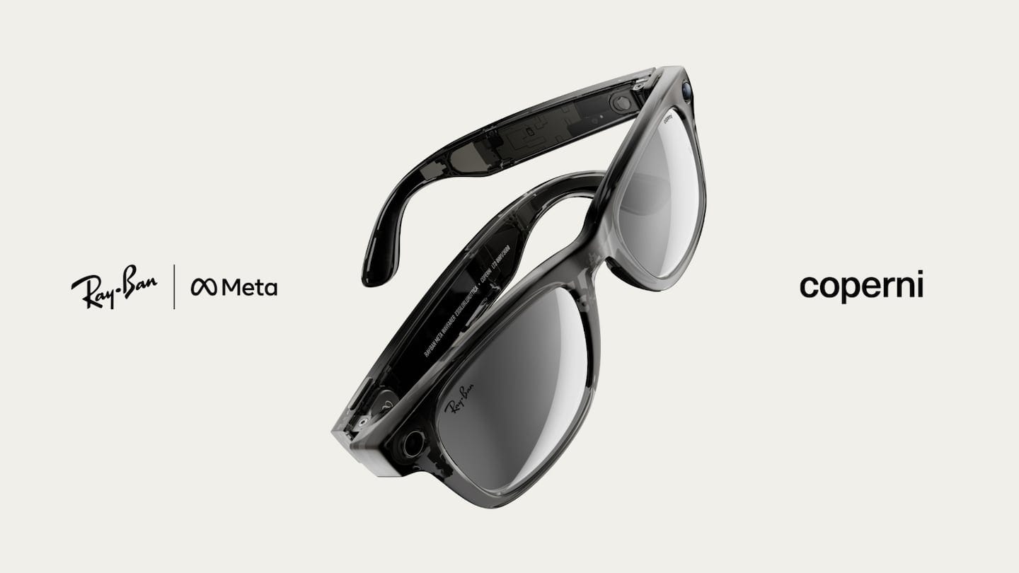 A pair of Ray-Ban Wayfarers with a semi-transparent frame showing the internal technology is positioned in the middle of frame.