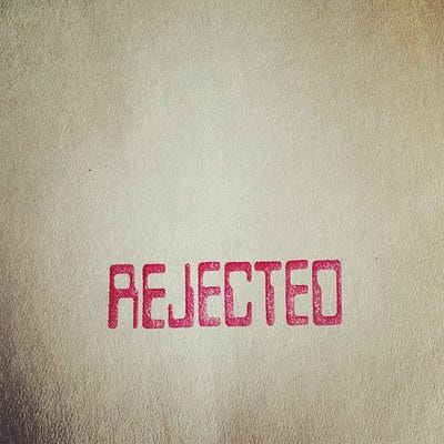 A red stamp that says "REJECTED" in all caps.