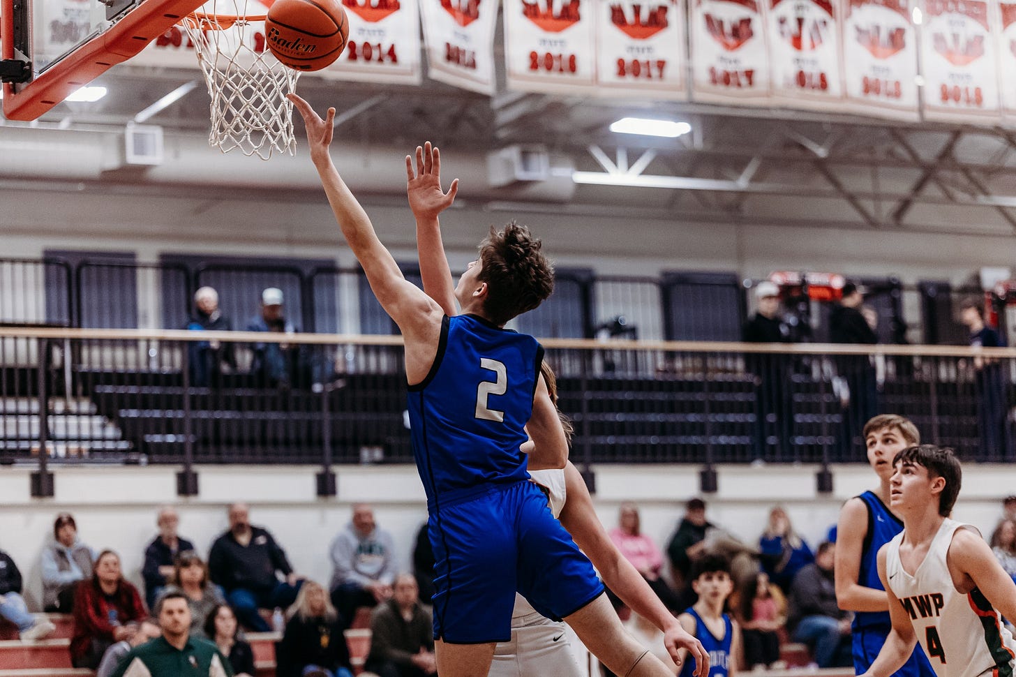 May be an image of 8 people and people playing basketball