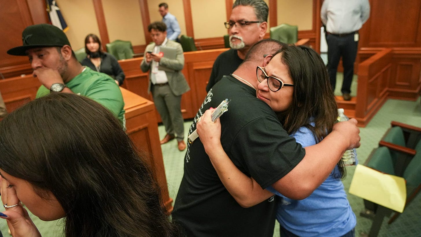 Family members of Uvalde victims Julissa Rizo and Javier Cazarez hug after the House Select Committee on Community Safety votes HB2744 out of committee at the Texas Capitol Monday, May 8, 2023. HB2744 would raise the age to purchase assault weapons.