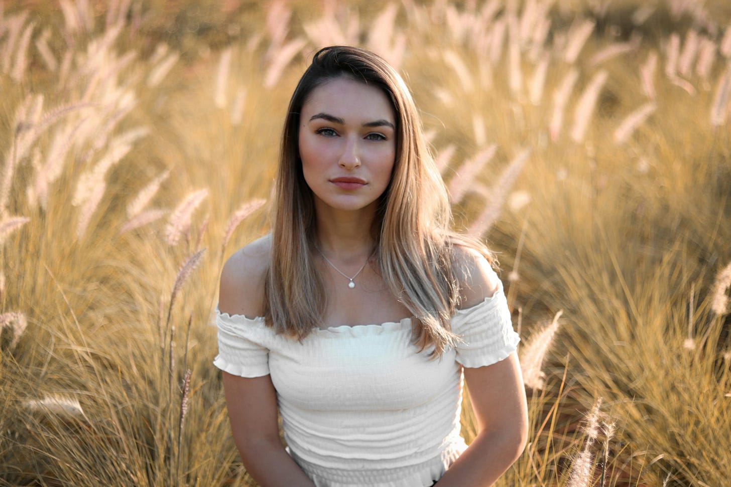 A pretty blonde woman in a field