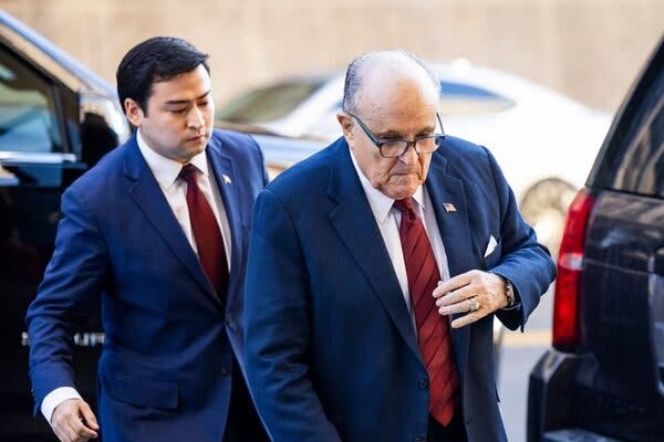 Rudolph W. Giuliani in a blue suit, red tie and white shirt.