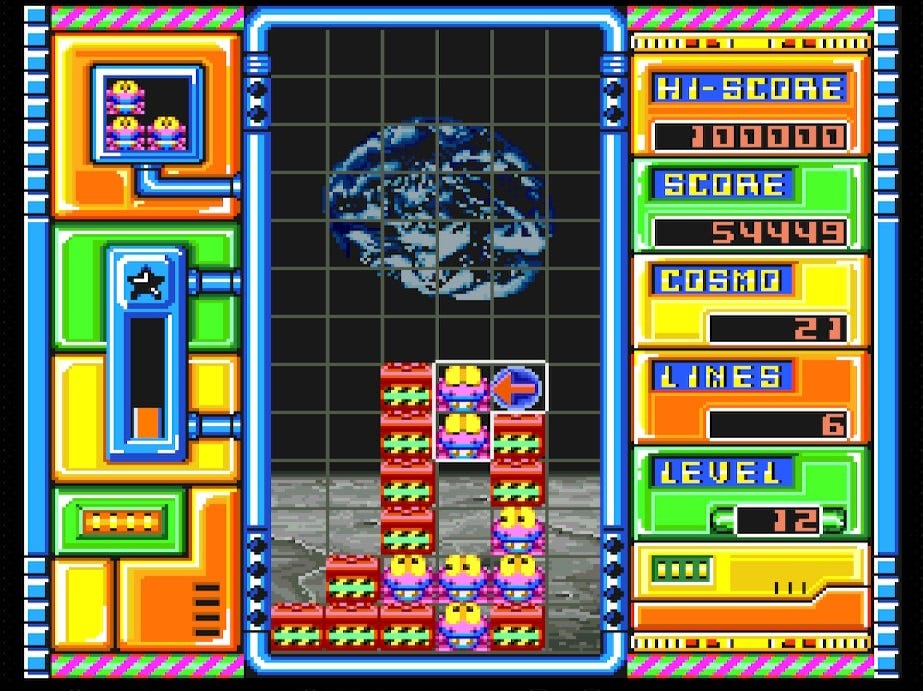 A screenshot from Cosmo Gang the Puzzle on the Super Famicom, showing the gridded playing area, and a block with two Jamms and one arrow orb being placed amid some red bricks. The background is the surface of the moon, with Earth in the background.