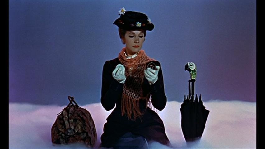 Image of Mary Poppins sitting on a cloud.