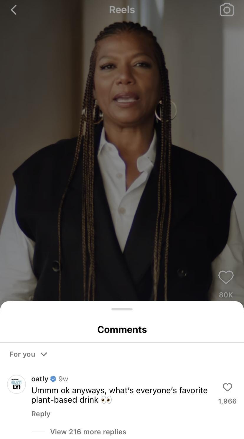 Oatly commenting on a Queen Latifah milk ad with "umm okay anyways, what's everyone's favorite plant-based drink?"