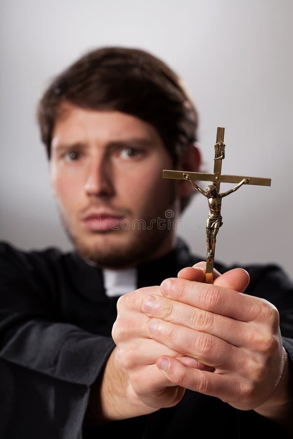 Exorcist with crucifix stock photo. Image of worship - 36573918