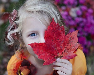 Girl with leaf in Nature