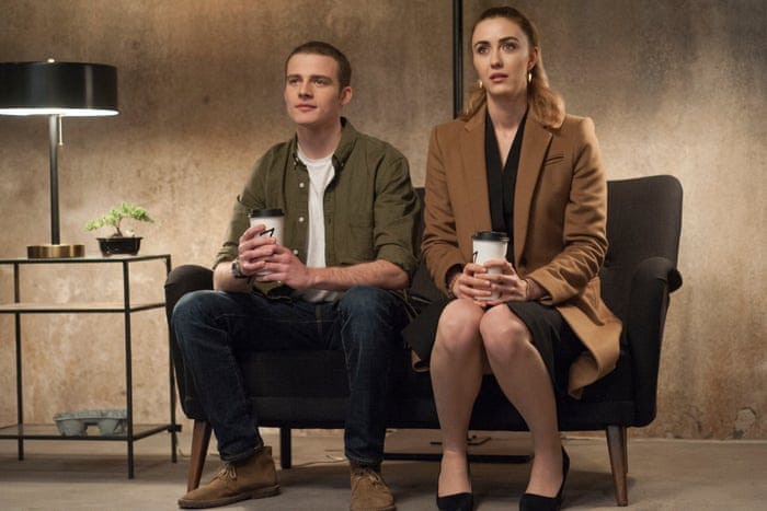 Screenshot from Twin Peaks the Return, a man and woman sit with to go coffees in a nondescript seating area that holds a dark secret.