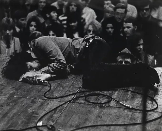 r/thedoors - Jim Morrison lying onstage during a Frankfurt concert in September 1968. Photo by MICHAEL MONTFORT, SWANN AUCTION GALLERIES
