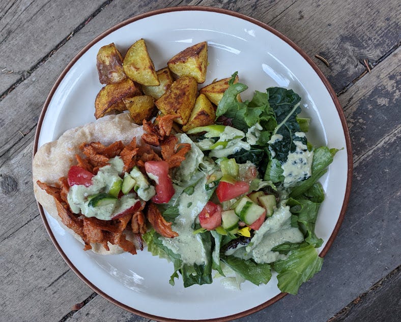 an open-faced buffalo chickwheat pita dinner